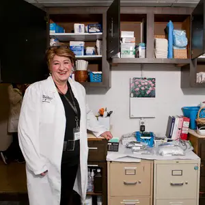 Judith Fouladbakhsh, Ph.D. in a medical office.